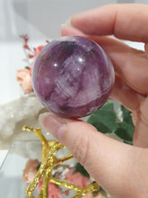 Load image into Gallery viewer, Purple Fluorite Sphere Crystal Carving Stone on Gold Branch shaped stand.
