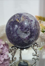 Load image into Gallery viewer, Purple Sphalerite Sphere Crystal Carving on Silver Stand.

Inspires Spirituality &amp; Strength

Stunning Purple Sphalerite Crystal Sphere on Silver Sand. This has a gorgeous quartz vein and pocket of druzy. 
