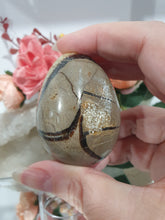 Load image into Gallery viewer, Beautiful polished Septarian Egg Crystal Carving Stone on plastic stand. A must for any crystal collector 
