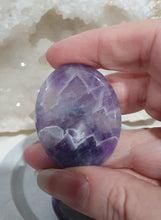 Load image into Gallery viewer, Worry Stone" Amethyst Crystal Carving Stone.

INSPIRES INTUITION AND SPIRITUALITY

What is a worry Stone? Perfectly shaped for your thumb, this crystal worry stone connects you to positive energy. Rubbing its smooth surface allows it to act as a powerful vessel for emotional release from anxiety and stress.

Lovely Amethyst crystal worry stone crystal carving.  Pop in your bag and keep with you to alleviate stress. Intuitively ( Randomly) chosen.

