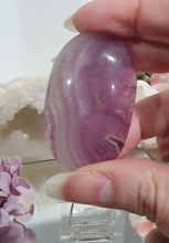 Load image into Gallery viewer, Fluorite Crystal Palm Stone palmstone on plastic stand. 

Inspires CONCENTRATION AND STABILITY

Lovely Fluorite Crystal Palm stone on plastic stand. So pretty.  
