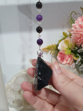 Load image into Gallery viewer, WITCHES AMULET - Handcrafted Obsidian Stone Crystal Energy Enhancer© / Hanger / Ornament / Suncatcher 

INSPIRES PROTECTION AND INTUITION

Gorgeous Obsidian raw crystal stone beaded with Black Obsidian and Amethyst. Wire wrapped in silver
