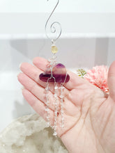 Load image into Gallery viewer, Lovely "EVERY CLOUD HAS A SILVER LINING" Fluorite Cloud silver wired Crystal Energy Enhancer© Hanger Ornament Suncatcher.

From Darkness comes Light.

TRANSFORMATION / INTUITION / SPIRITUALITY

Beautiful Fluorite Cloud Crystal Carving beaded with Fluorite &amp; Quartz. wired in Silver
