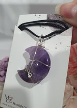 Load image into Gallery viewer, Amethyst Moon Crystal Pendant Wire Wrapped Silver Stone with black cord chain

INSPIRES INTUITION AND SPIRITUALITY

Beautiful Amethyst Moon Crystal Carving Wire Wrapper in Silver non tarnish wire. Accompanied by a black cord necklace
