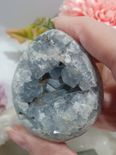 Load image into Gallery viewer, Celestite Egg Crystal Carving on silver Stand.

Inspires Communication with the Angels

Gorgeous Celestite egg Crystal Carving on silver Stand.
