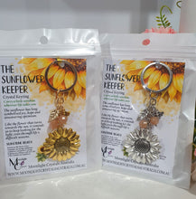 Load image into Gallery viewer, "THE SUNFLOWER KEEPER" Metal Sunflower with Sunstone Beads Crystal Keyring.

Choose from Gold of Silver medal colour.

INSPIRES JOY | HOPE | OPTIMISM

Carry a little Sunshine wherever life takes you!

 "The sunflower has long symbolised joy, hope and unwavering optimism. Like the flower that turns towards the sun, it reminds us to keep looking for the light, even through life's difficult seasons".

Gorgeous Metal sunflower Keyring Key ring beaded with AAA sunstone faceted beads.

