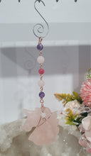 Load image into Gallery viewer, HEART OF A UNICORN" Aura Howlite Heart Stone Rose Gold Crystal Energy Enhancer© Hanger Ornament Suncatcher

Gorgeous Rose Quartz Unicorn Crystal Carving beaded with Amethyst, Rose Quartz, Rhodochrosite and Quartz. Wire wrapped in Rose Gold

