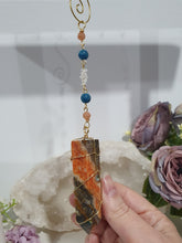 Load image into Gallery viewer, WAND OF EMPOWERMENT Sunstone Crystal Tower Stone Gold Wired Crystal Energy Enhancer© Hanger Ornament Suncatcher.  Crystal Suncatcher. Inspires Courage, Joy &amp; Knowledge
