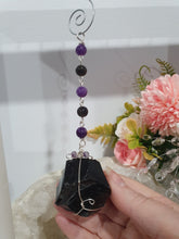 Load image into Gallery viewer, WITCHES AMULET - Handcrafted Obsidian Stone Crystal Energy Enhancer© / Hanger / Ornament / Suncatcher 

INSPIRES PROTECTION AND INTUITION

Gorgeous Obsidian raw crystal stone beaded with Black Obsidian and Amethyst. Wire wrapped in silver
