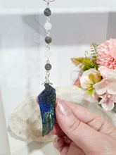 Load image into Gallery viewer, Labradorite Feather Stone Silver Wired Crystal Energy Enhancer© / Hanger / Ornament / Sun Catcher

Inspires ANGELIC CONNECTION | STRENGTH | INTUITION

Gorgeous Labradorite feather stone crystal carving beaded with Labradorite and Moonstone. Wired in Silver
