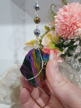 Load image into Gallery viewer, COSMIC ARMOUR - Handcrafted Rainbow Obsidian Stone Crystal Energy Enhancer© / Hanger / Ornament / Suncatcher 

INSPIRES PROTECTION AND GROUNDING

Gorgeous Rainbow Obsidian raw crystal stone beaded with Rainbow Hematite and Hematite. Wire wrapped in silver
