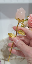 Load image into Gallery viewer, Rose Flower Rose Quartz Crystal Carving with gold stem.

Promotes Unconditional Love and Harmony

Beautiful Rose Quartz Flower / Rose Crystal Carving with gold stem and leaves.    
