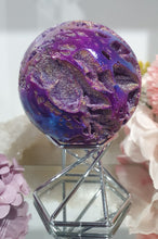 Load image into Gallery viewer, Pink Titanium Aura Sphalerite Sphere Crystal Carving on Silver Stand.

PROMOTES PSYCHIC DEVELOPMENT AND UPLIFTS

Absolutely Stunning Pink Titanium Aura Sphalerite Crystal Sphere on Silver Sand. The druzy on this in insane!. 
