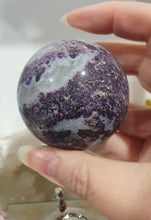 Load image into Gallery viewer, Purple Sphalerite Sphere Crystal Carving on Silver Stand.

Inspires Spirituality &amp; Strength

Stunning Purple Sphalerite Crystal Sphere on Silver Sand. This has a gorgeous quartz vein and pocket of druzy. 
