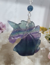 Load image into Gallery viewer, THE MYSTICAL UNICORN" Handcrafted Fluorite Unicorn Crystal Carving Silver Crystal Energy Enhancer© Gemstone / Hanger / Suncatcher / Ornament

PURITY | STRENGTH | MAGIC

Beautiful Fluorite Unicorn Carving Crystal Energy Enhancer© / Sun Catcher / Ornament / Hanger beaded with Fluorite and Quartz.  wired in Silver
