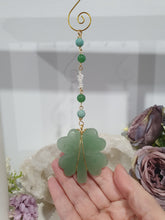 Load image into Gallery viewer, "FOUR-LEAF CLOVER BLESSINGS" Aventurine Crystal Carving Gold Stone Crystal Energy Enhancer© / Hanger / Ornament / Suncatcher

GOOD FORTUNE | HOPE | MAGIC | PROTECTION

A four-leaf clover Symbolises good luck and abundance. It is believed if you hold a four-leaf clover you will gain the ability to see fairies and leprechauns and find their treasures.&nbsp;

Beautiful Aventurine four-leaf clover crystal carving beaded with Amazonite, Aventurine and Quartz. Wire wrapped in Gold

