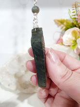 Load image into Gallery viewer, Labradorite Feather Stone Silver Wired Crystal Energy Enhancer© / Hanger / Ornament / Sun Catcher

Inspires ANGELIC CONNECTION | STRENGTH | INTUITION

Gorgeous Labradorite feather stone crystal carving beaded with Labradorite and Moonstone. Wired in Silver
