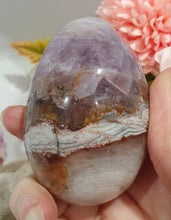 Load image into Gallery viewer, Amethyst Agate Egg Crystal Carving Stone on Stand

Inspires intuition and Emotional Well Being

Beautiful Polished Amethyst Agate Egg Crystal Carving on plastic stand. Has natural divits formations.
