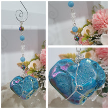 Load image into Gallery viewer, HEART OF THE OCEAN" Handcrafted Titanium Aura Sphalerite Heart Crystal Carving Silver Crystal Energy Enhancer© / Hanger / Ornament / Suncatcher

Inspires PSYCHIC FLOW | LOVE | INTUITION

Gorgeous Titanium Aura Sphalerite heart crystal carving stone beaded with Aquamarine, Rainbow Hematite &amp; Quartz.  Wire wrapped in silver
