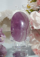 Load image into Gallery viewer, Fluorite Crystal Palm Stone palmstone on plastic stand. 

Inspires CONCENTRATION AND STABILITY

Lovely Fluorite Crystal Palm stone on plastic stand. So pretty.  
