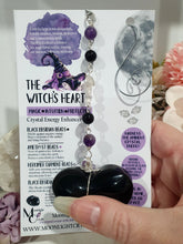 Load image into Gallery viewer, THE WITCHES HEART" Handcrafted Obsidian Heart Crystal Carving Stone Silver Crystal Energy Enhancer© Hanger Ornament Suncatcher 

INSPIRES MAGIC, INTUITION AND PROTECTION

Gorgeous Obsidian heart crystal carving stone beaded with Black Obsidian, Amethyst and Herkimer Diamonds. Wire wrapped in silver
