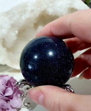 Load image into Gallery viewer, Sparkly Blue Sandstone Sphere Crystal Carving on Silver Stand. Inspires Concentration and Courage. Gorgeous
