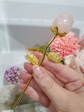 Load image into Gallery viewer, Rose Flower Rose Quartz Crystal Carving with gold stem.

Promotes Unconditional Love and Harmony

Beautiful Rose Quartz Flower / Rose Crystal Carving with gold stem and leaves.

