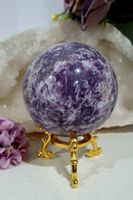 Load image into Gallery viewer, Unicorn Stone Sphere Crystal Carving on Gold Stand. Inspires Calmness, Empathy and Joy. 
Unicorn Stone consists of Pink Tourmaline, Lepidolite &amp; Smokey Quartz
