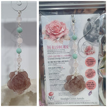 Load image into Gallery viewer, "THE BLUSHING ROSE" Strawberry Quartz Rose Carving silver Crystal Energy Enhancer© Hanger Ornament Suncatcher.

HAPPINESS / LOVE / HARMONY

"THE BLUSHING ROSE - Like the petals of a rose unfolding, The Blushing Rose encourages us to embrace self-love, joy and the beauty within."

Gorgeous Strawberry Quartz Rose Crystal Carving beaded with Ice Pink Malaysian Jade, Rose Quartz, Amazonite and Quartz. Wire wrapped in silver
